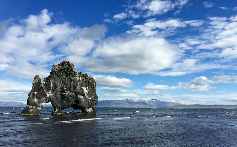 Rock Formation in Sea — Blue, Serene, Afternoon, Photograph, Mountains, Clouds