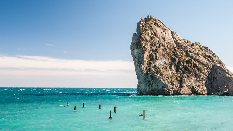 Rock Formation in Sea — Blue, Serene, Afternoon, Photograph, Sky