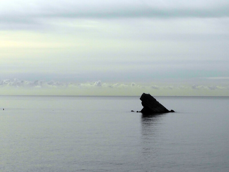 Rock Formation in Sea — Gray
