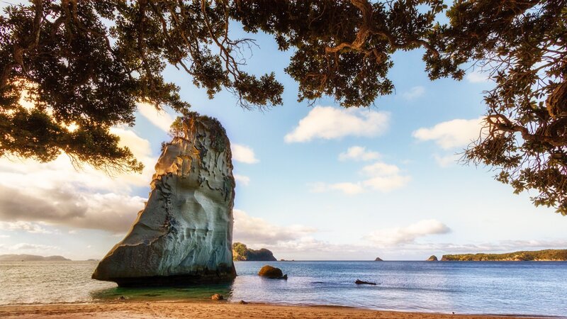 Rock Formation on Beach — Blue, Serene, Sunset, Photograph, Tree