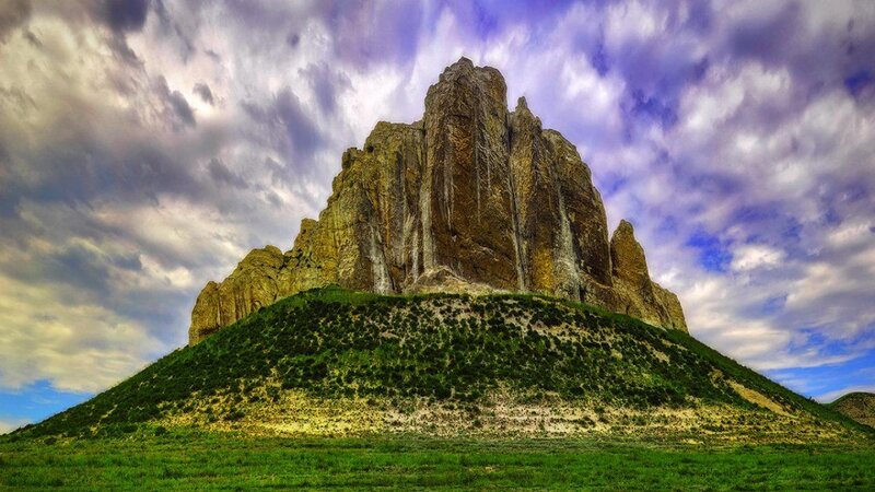 Rock Formation on Hill — Green, Dramatic, Afternoon