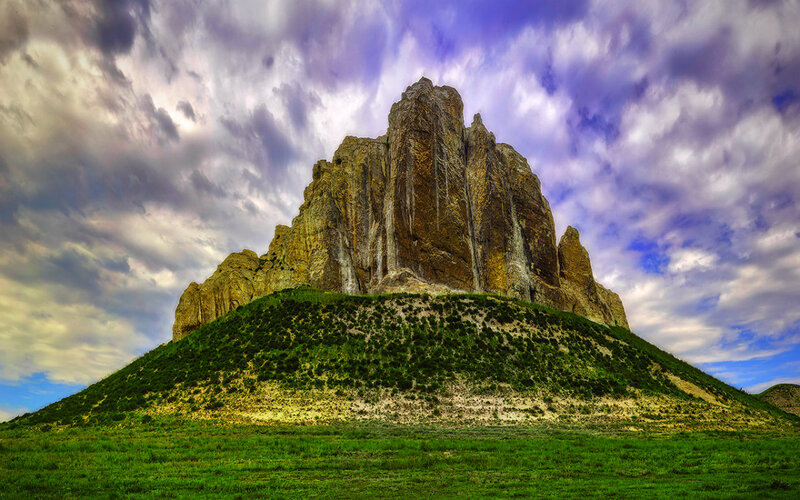Rock Formation on Hill — Green, Dramatic