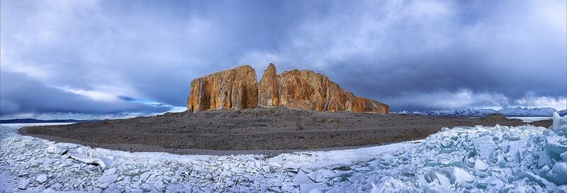 Rock formation on icy landscape
