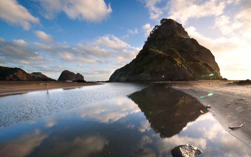 Rock formation reflected in tide pool