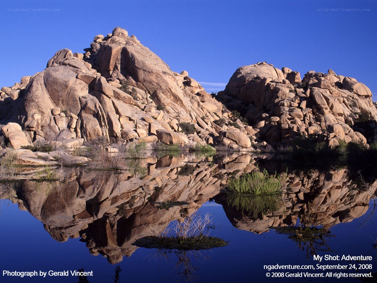 Rock formation reflected in water