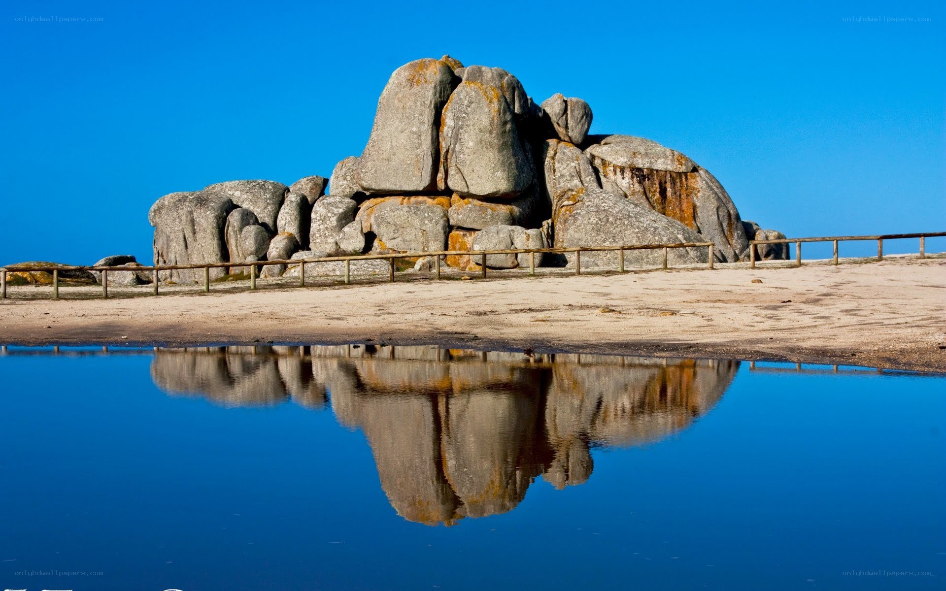 Rock formation reflected in water