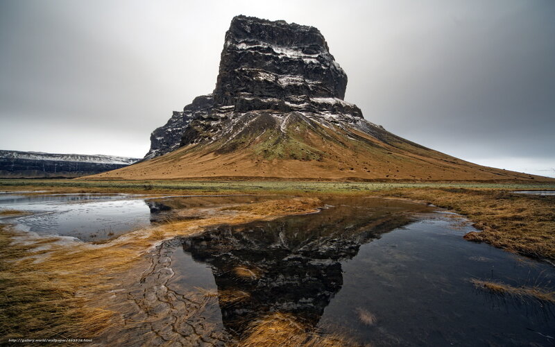 Rock formation reflected in water