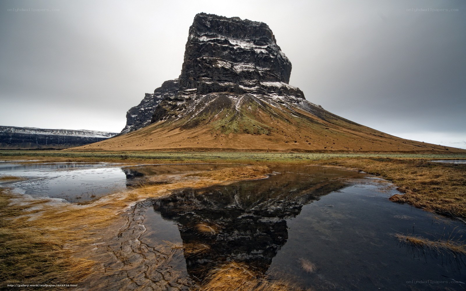Rock formation reflected in water