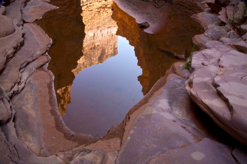 rock formation reflection in water