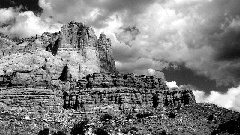 Rock Formation under Cloudy Sky — Black