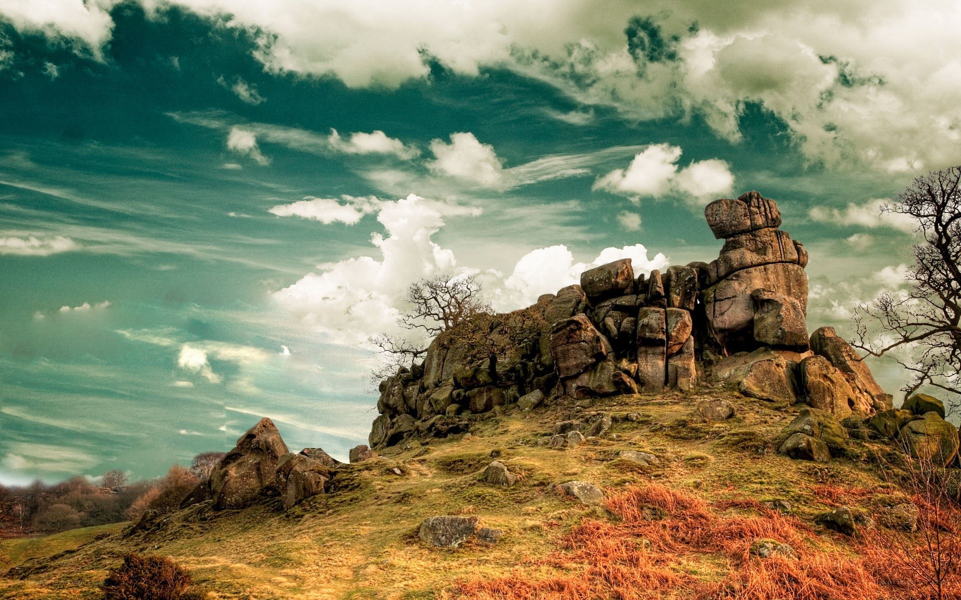 Rock formation under cloudy sky