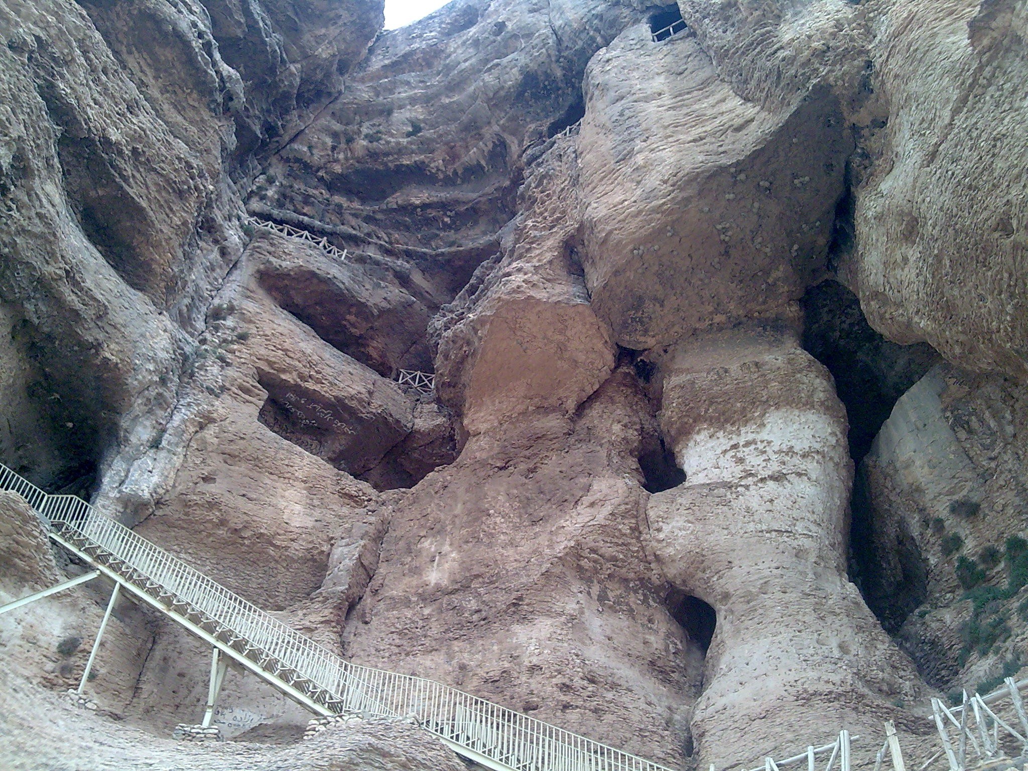 rock formation with metal staircase