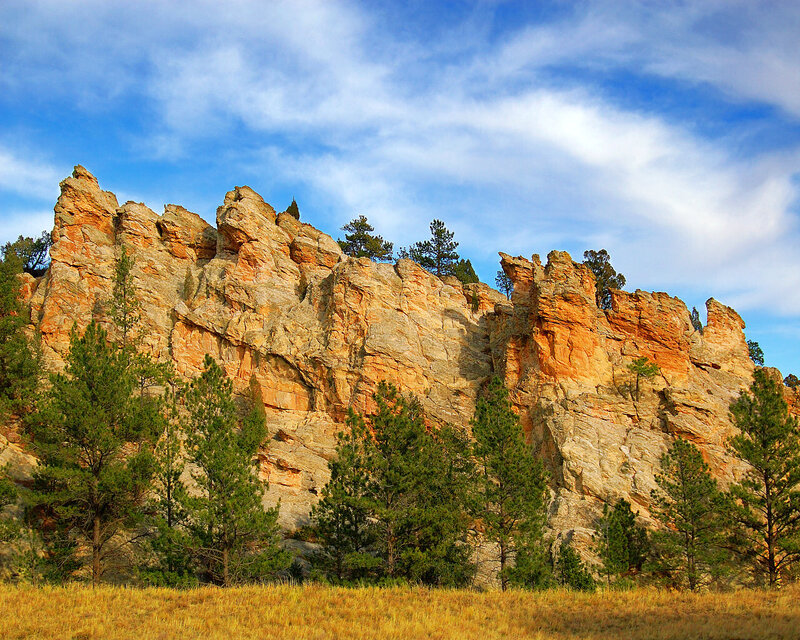 Rock formation with pine trees