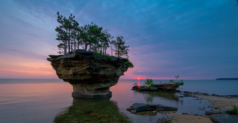 Rock Formation with Trees — Blue, Serene, Sunset