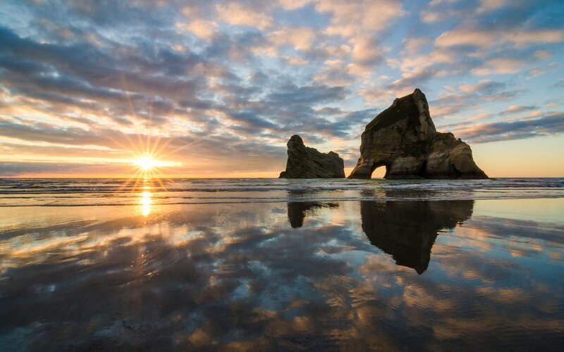 Rock Formations at Sunset — Blue, Serene, Photograph, Sun, Beach, Clouds