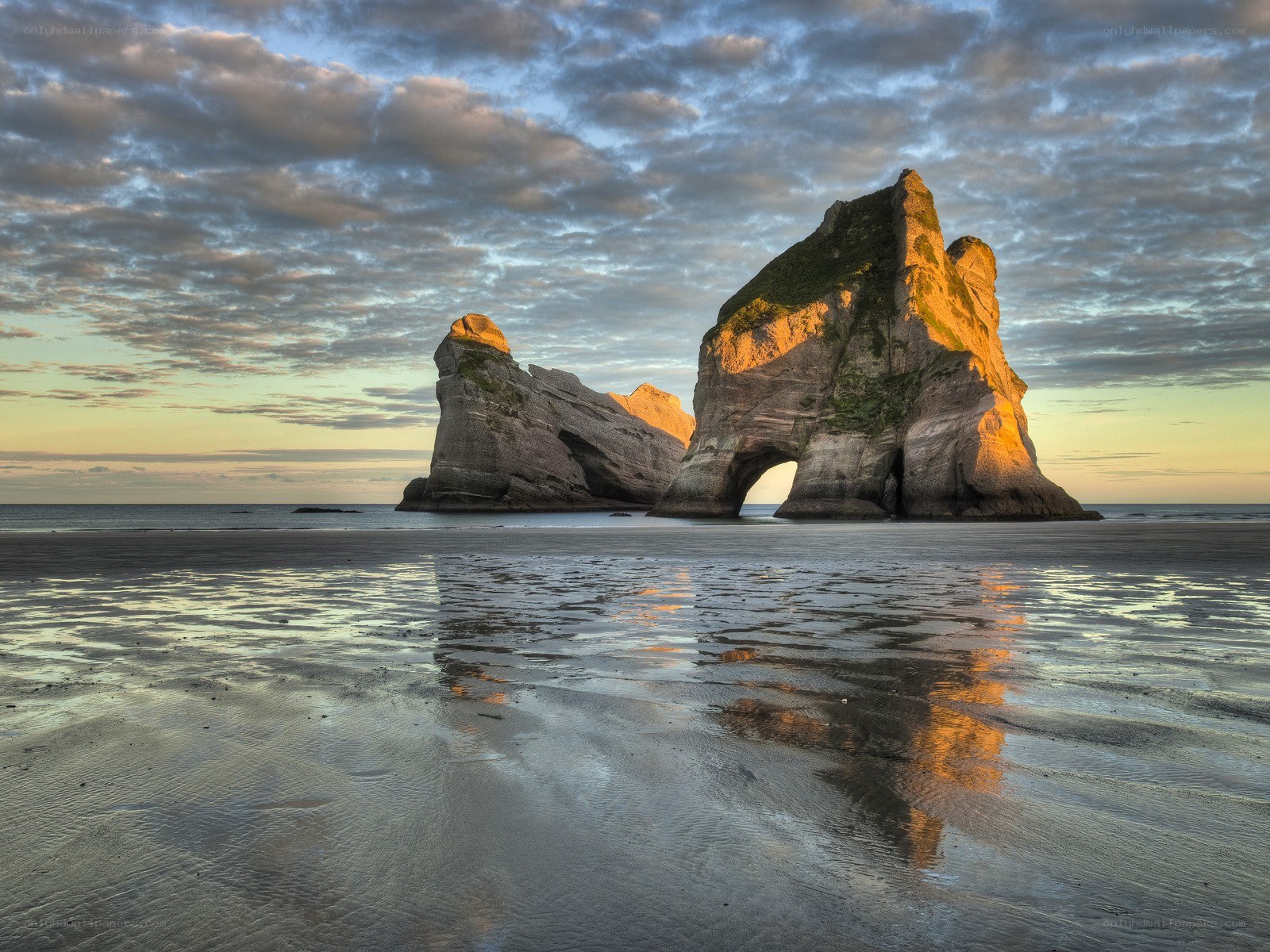 Rock formations at sunset on a beach