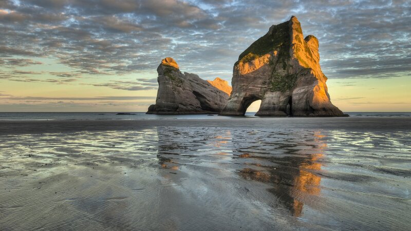 Rock formations at sunset on a beach