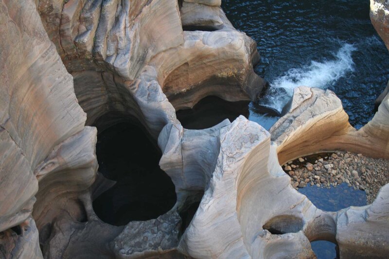 Rock Formations by River — Brown