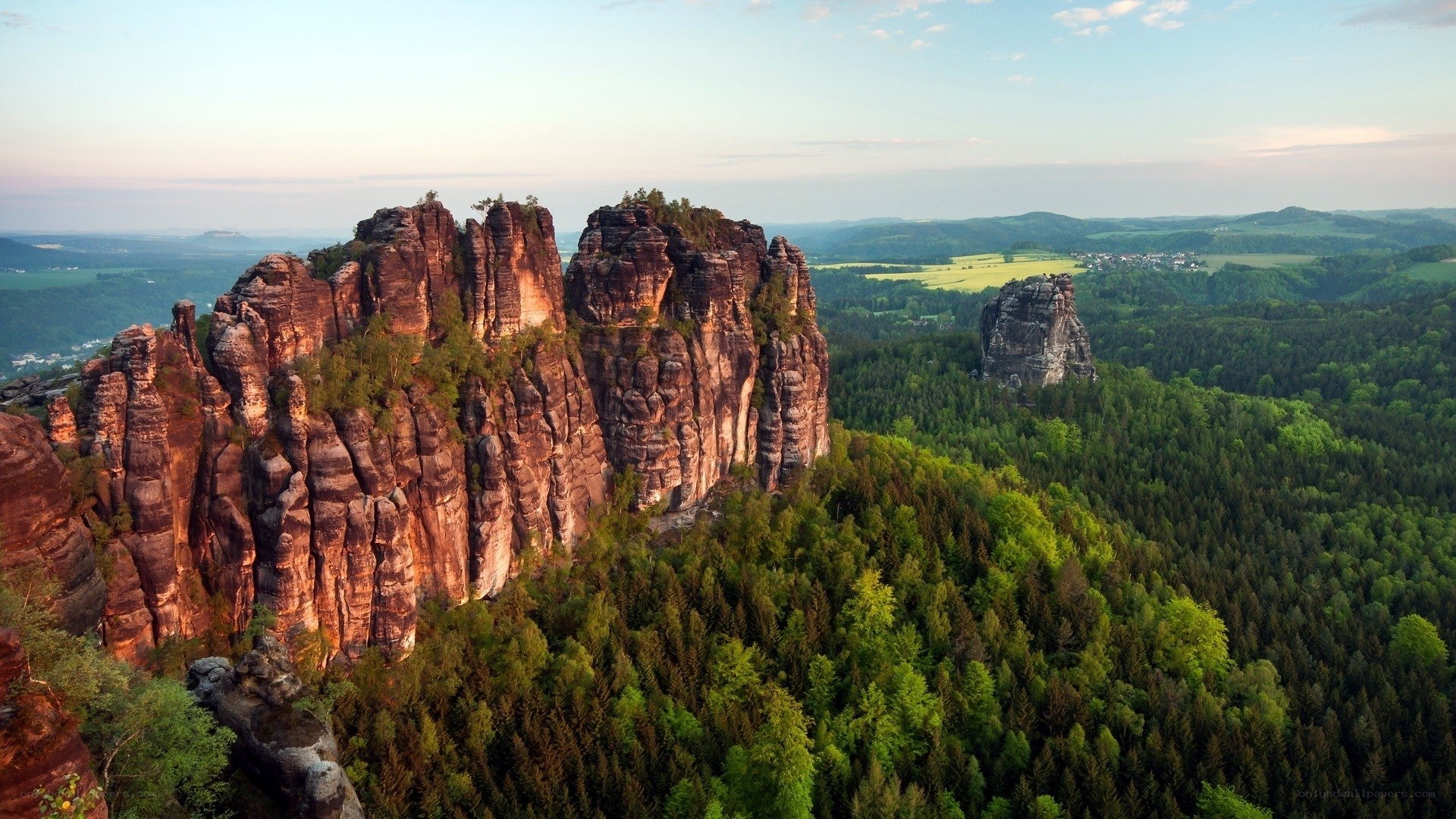 Rock formations in a forested landscape