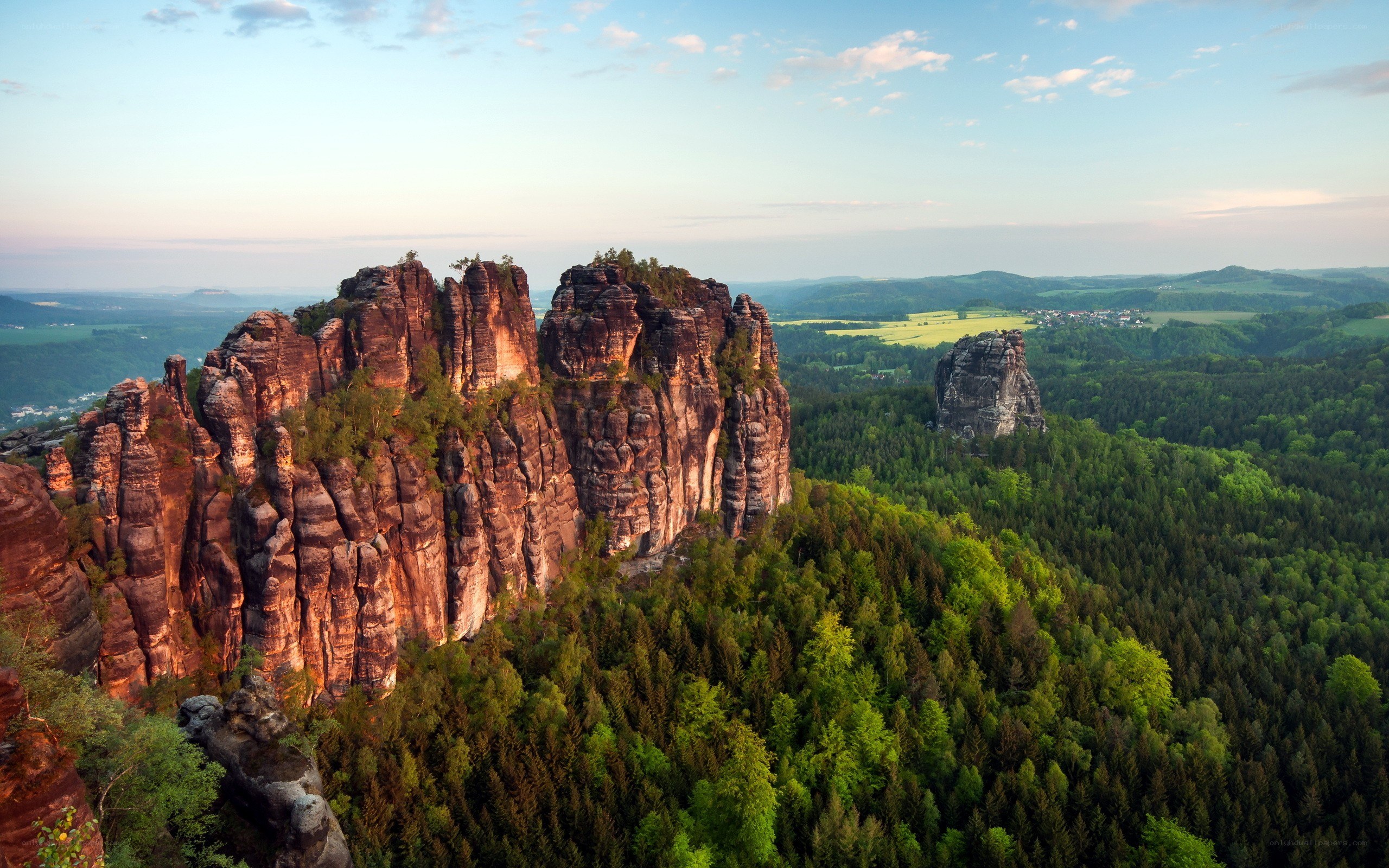 Rock formations in a forested valley