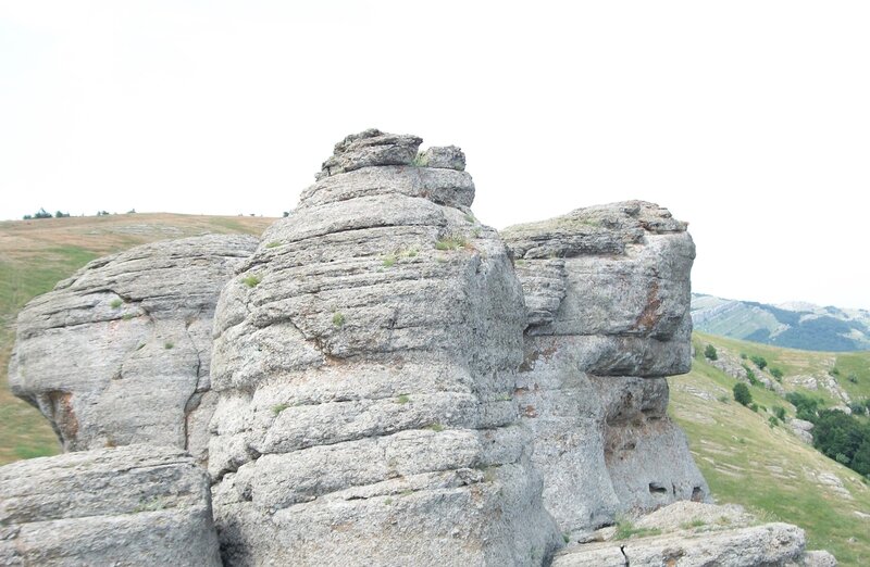 Rock formations in a hilly landscape