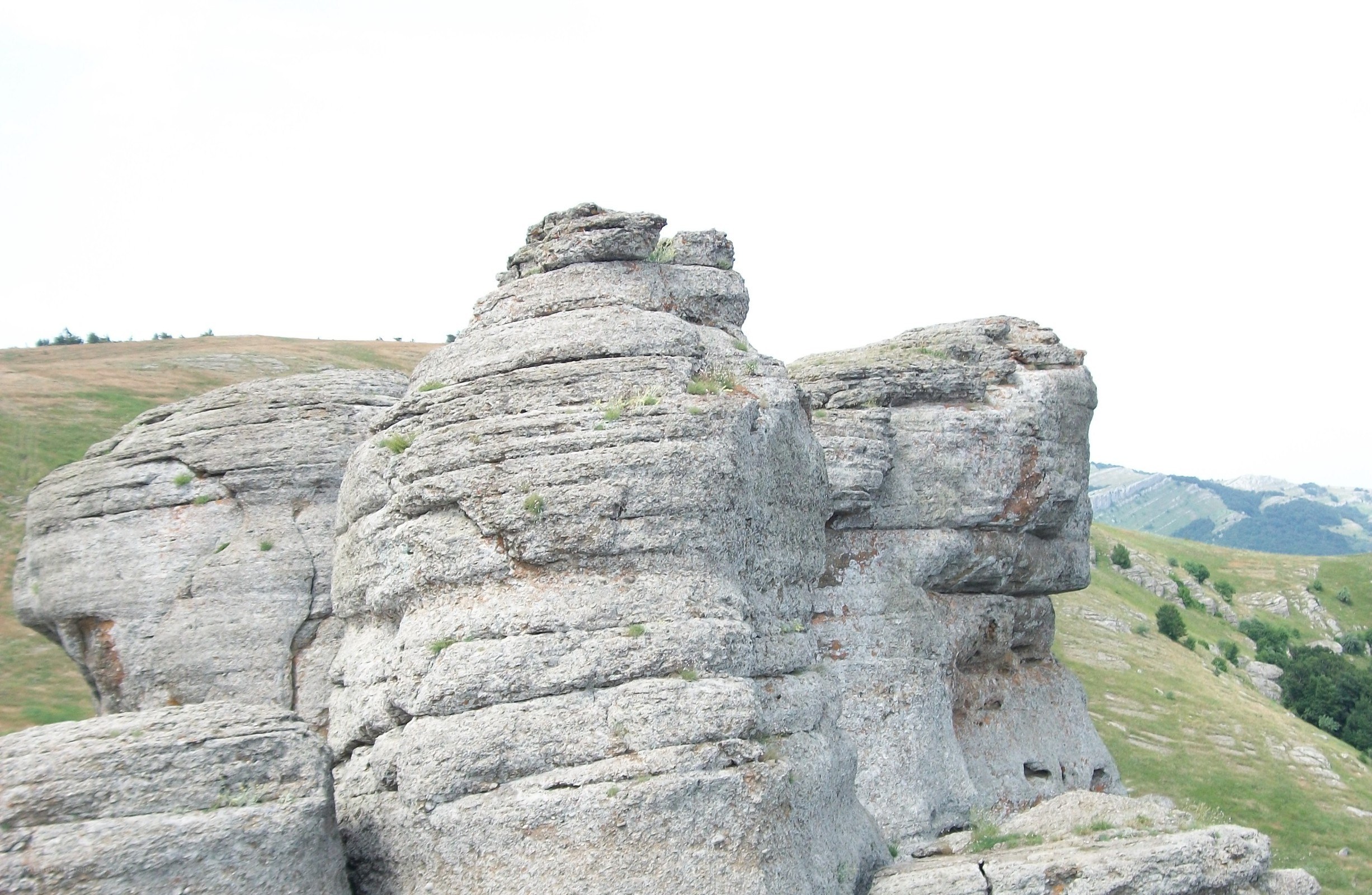 Rock formations in a hilly landscape
