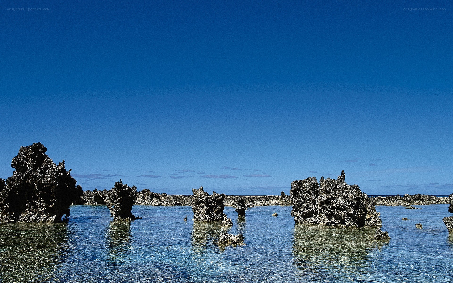 Rock formations in clear water