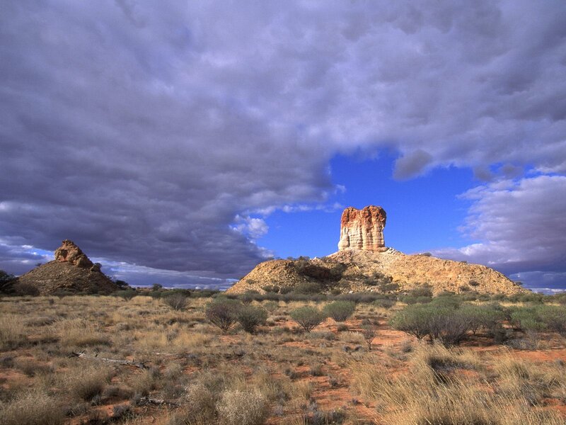 Rock Formations in Desert — Blue, Dramatic, Afternoon, Photograph, Clouds, Dunes