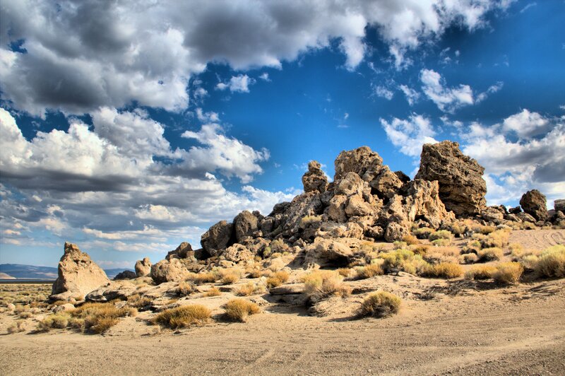 Rock Formations in Desert — Blue, Dramatic, Afternoon, Photograph, Clouds, Sand