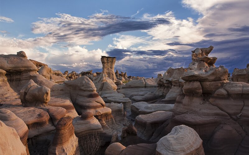 Rock Formations in Desert — Blue, Dramatic, Sunset, Photograph, Clouds, Sky, Sandstone