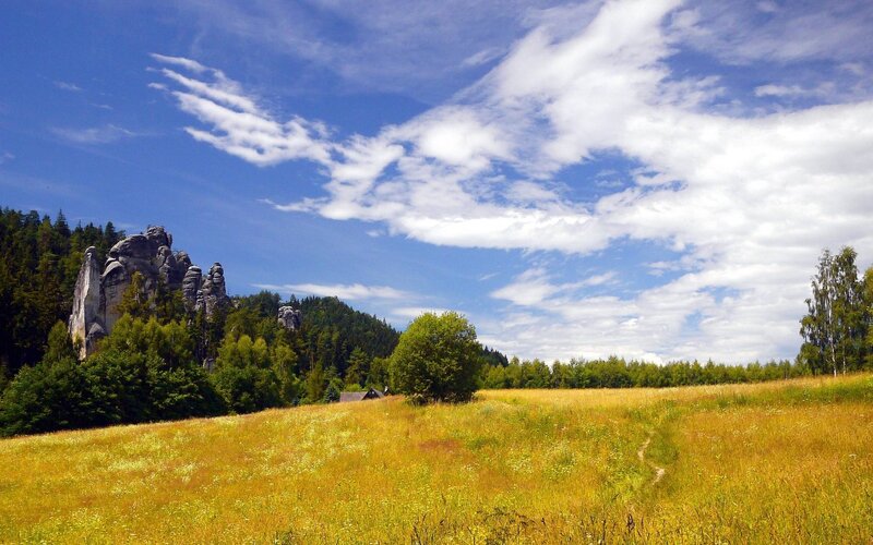 Rock Formations in Field — Blue, Serene