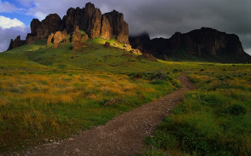 Rock Formations in Field — Green, Dramatic
