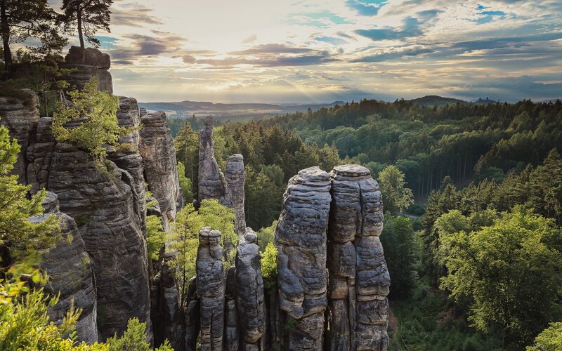 Rock Formations in Forest — Green, Serene, Sunset, Photograph, Sky