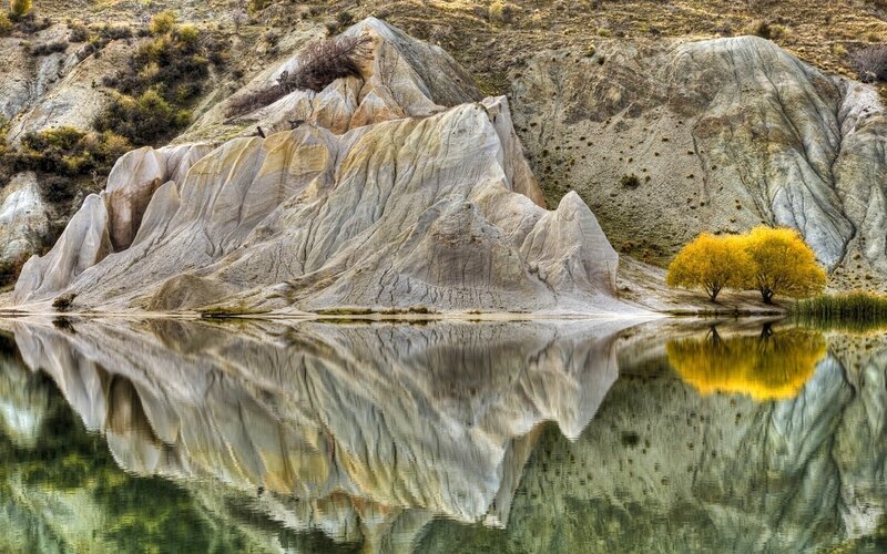 Rock Formations in Lake — Yellow, Serene