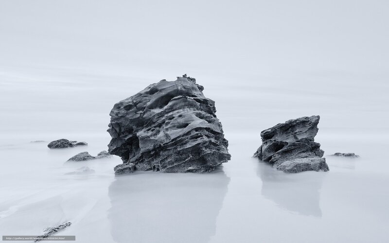 Rock formations in misty water