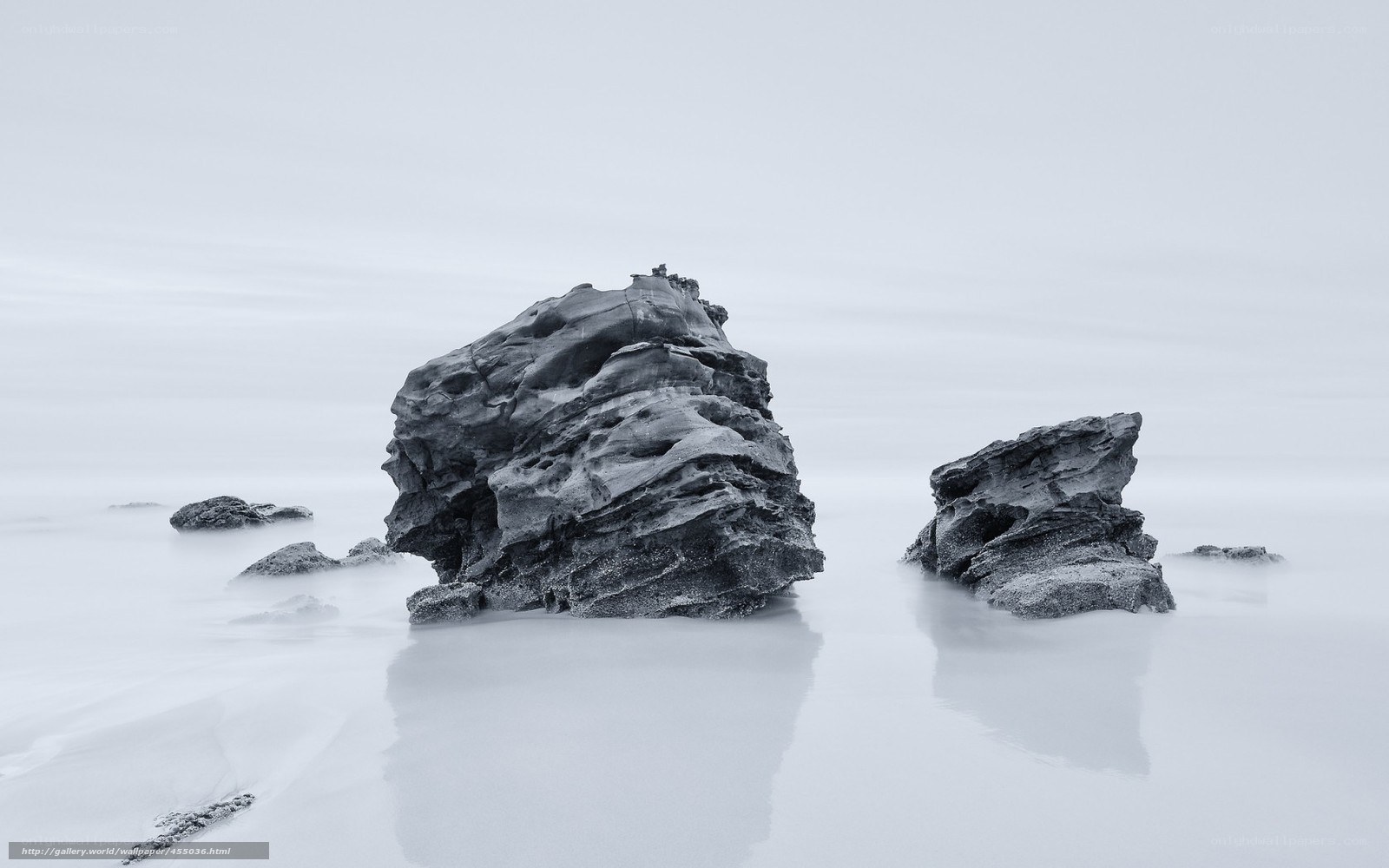 Rock formations in misty water