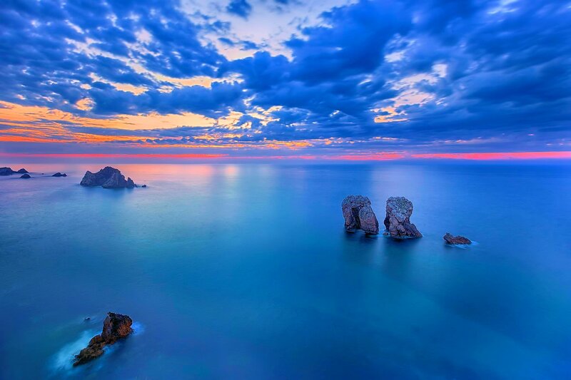 Rock Formations in Ocean — Blue, Dramatic, Sunset, Photograph, Sky, Clouds