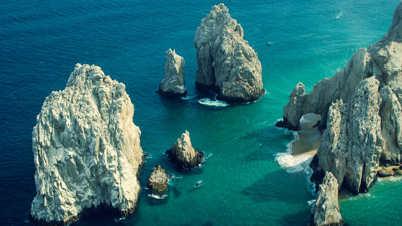 Rock Formations in Ocean — Blue, Serene, Afternoon, Photograph, Boat