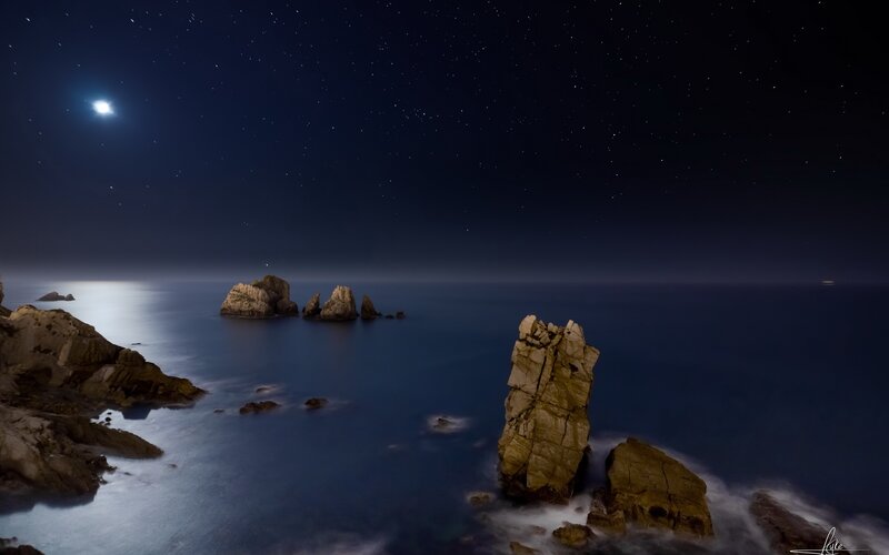 Rock Formations in Ocean — Blue, Serene, Night, Photograph, Moon, Stars