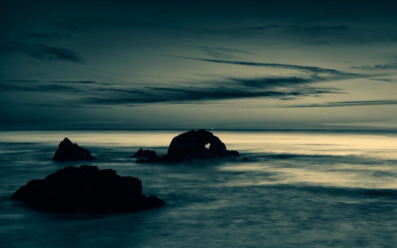 Rock Formations in Ocean — Blue, Serene, Night, Photograph, Sky, Clouds