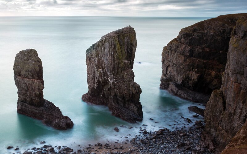 Rock Formations in Ocean — Blue, Serene, Photograph, Cliffs, Sky