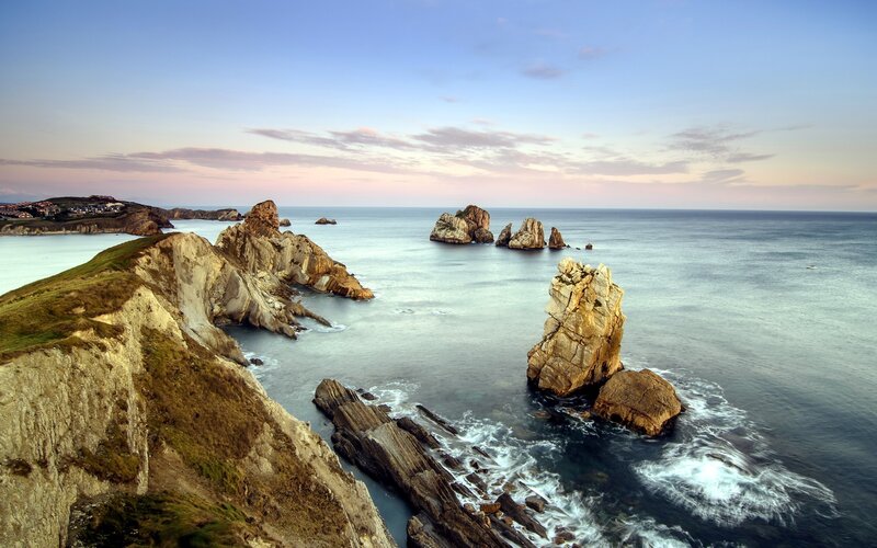 Rock Formations in Ocean — Blue, Serene, Sunset, Photograph, Cliffs, Sea