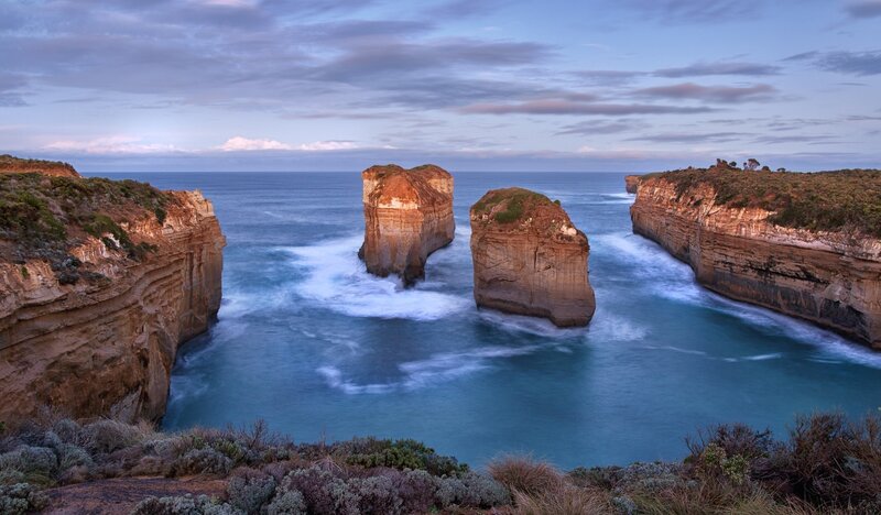 Rock Formations in Ocean — Blue, Serene, Sunset, Photograph, Cliffs