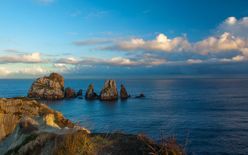 Rock Formations in Ocean — Blue, Serene, Sunset, Photograph, Clouds