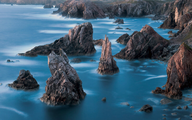 Rock Formations in Ocean — Blue, Serene, Sunset, Photograph