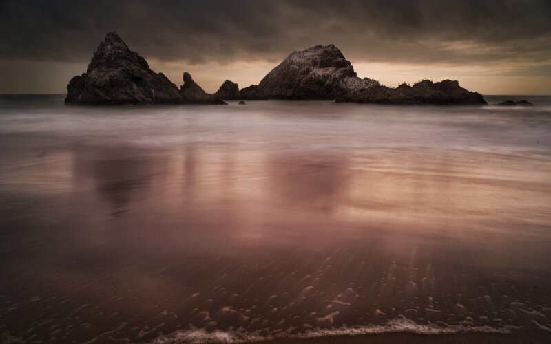Rock Formations in Ocean — Brown, Dramatic, Sunset
