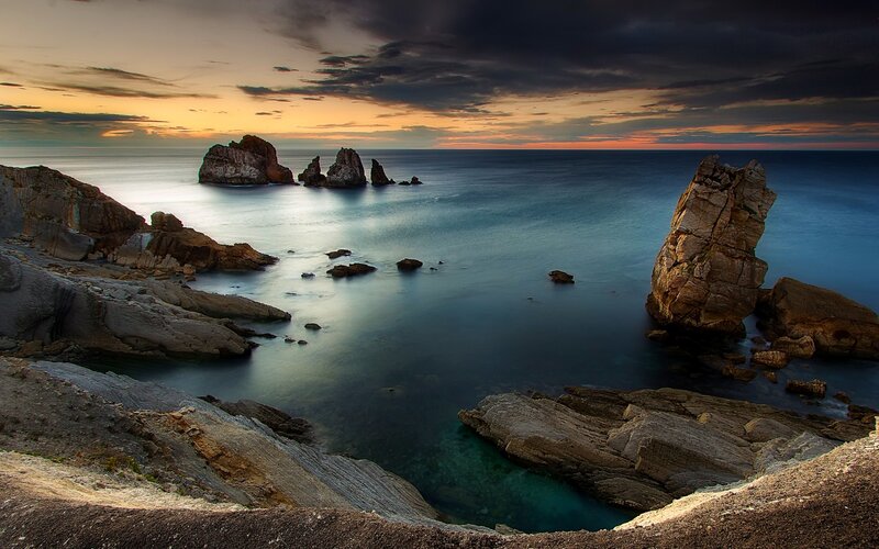 Rock Formations in Sea — Blue, Dramatic, Sunset, Photograph, Rocks