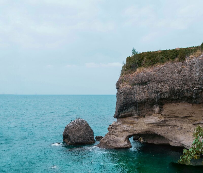 Rock Formations in Sea — Blue, Serene, Afternoon, Photograph, Birds