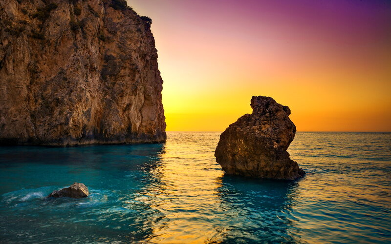 Rock Formations in Sea — Blue, Serene, Sunset, Photograph