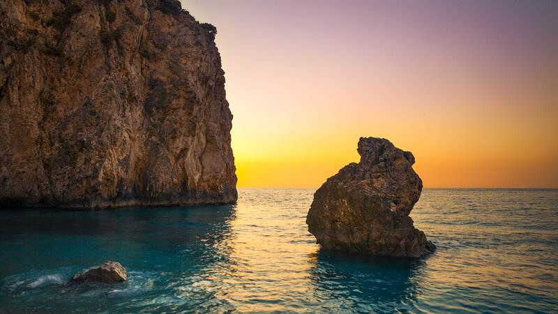 Rock Formations in Sea — Blue, Serene, Sunset